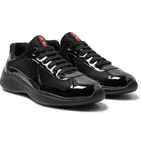 black patent leather prada sneakers.